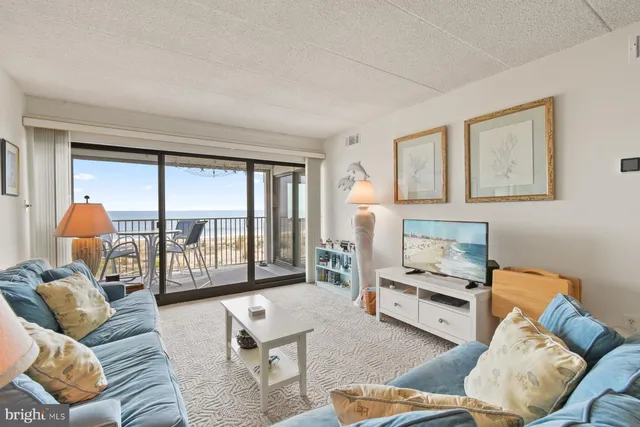 a bedroom with bed and a large window with outer view