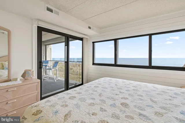 a bedroom with a large bed and a closet