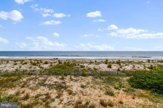 a view of a large building with a swimming pool