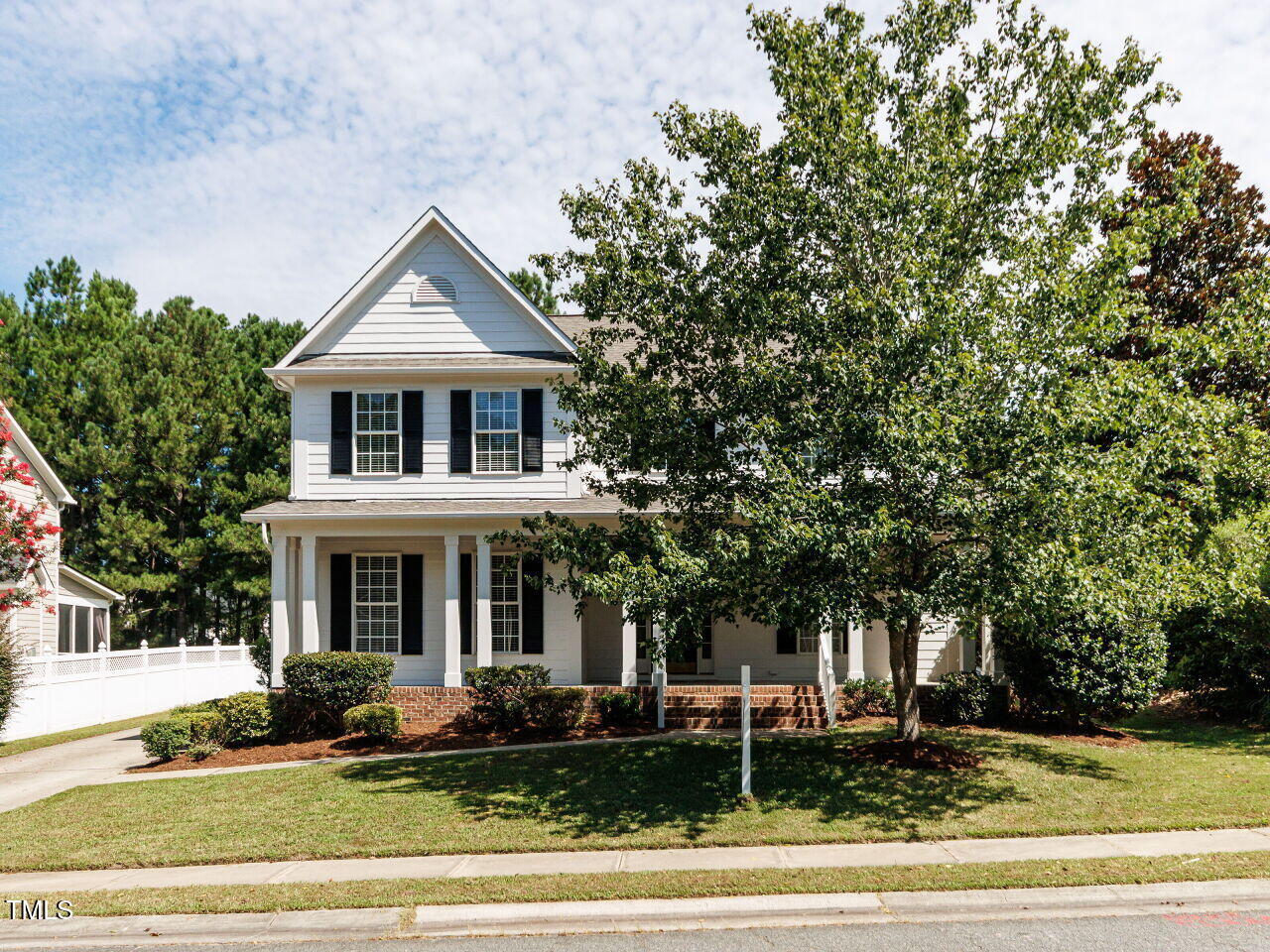30158 Pharr Chapel Hill, NC 27517 - Photo 1 of 40 a front view of a house with trees and plants