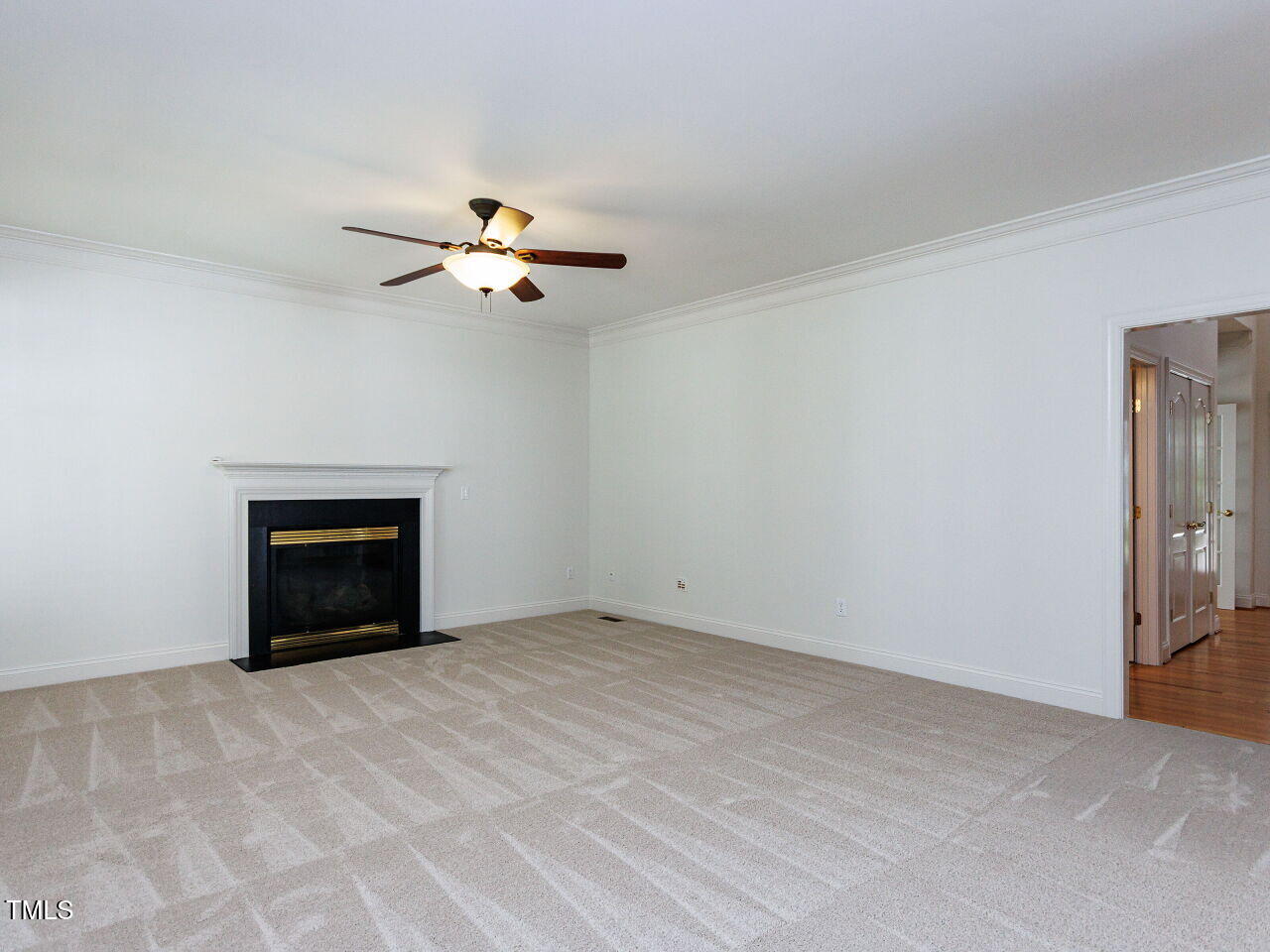 30158 Pharr Chapel Hill, NC 27517 - Photo 13 of 40 a view of a room with a ceiling fan and a fireplace