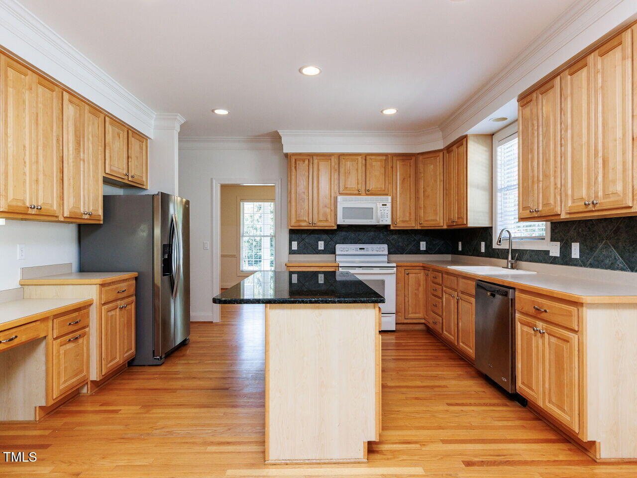 30158 Pharr Chapel Hill, NC 27517 - Photo 15 of 40 a large kitchen with stainless steel appliances granite countertop a stove a sink a refrigerator and white cabinets with wooden floor