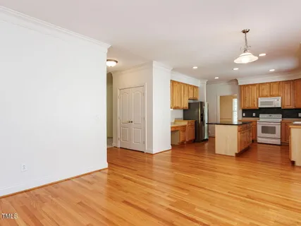 a view of kitchen with microwave and cabinets