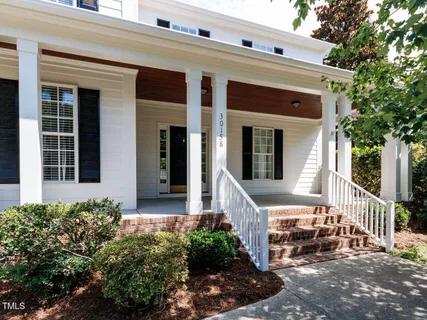 a front view of a house with a porch