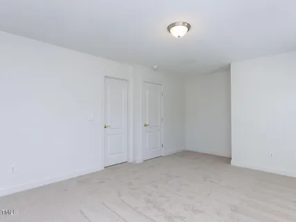 a view of a balcony with wooden floor