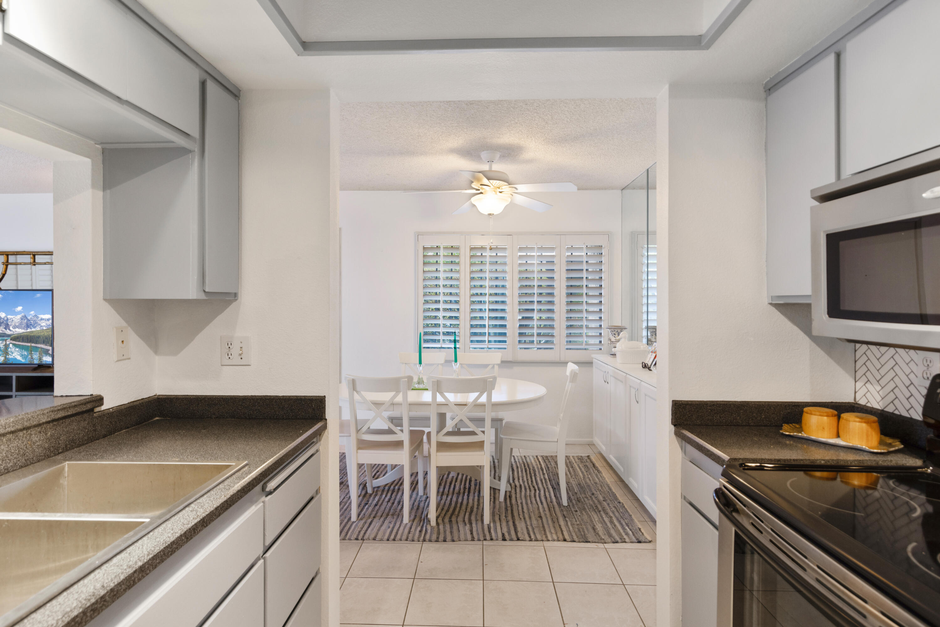 1111 Ramon Road, Unit 28 Palm Springs, CA 92264 - Photo 10 of 28 a kitchen with a sink appliances and cabinets