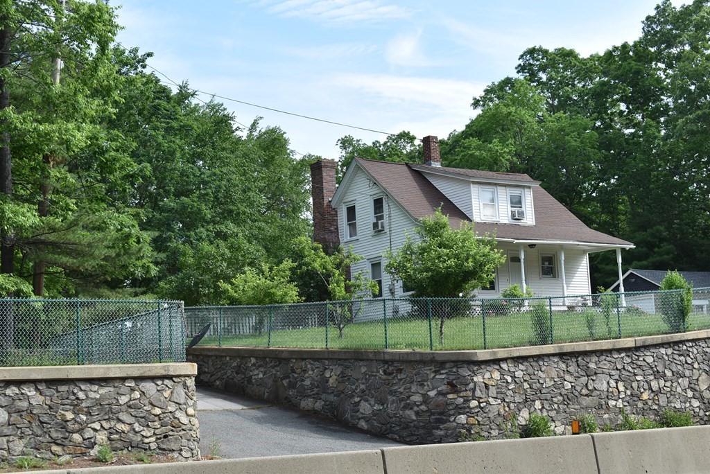 371 Worcester Road Charlton, MA 01507 - Photo 1 of 35 a front view of a house with a garden