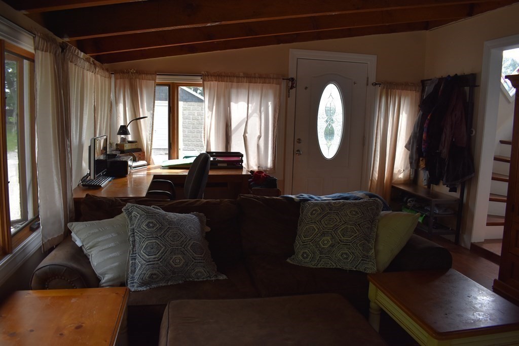371 Worcester Road Charlton, MA 01507 - Photo 14 of 35 a living room with furniture and a large mirror