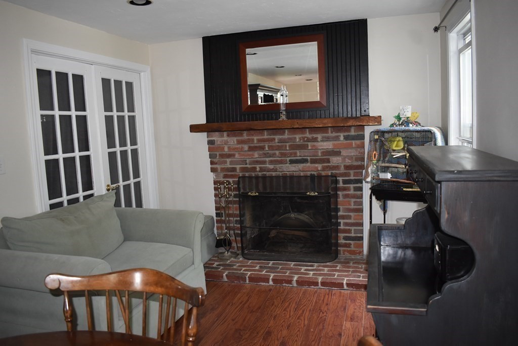371 Worcester Road Charlton, MA 01507 - Photo 16 of 35 a living room with furniture and a fireplace