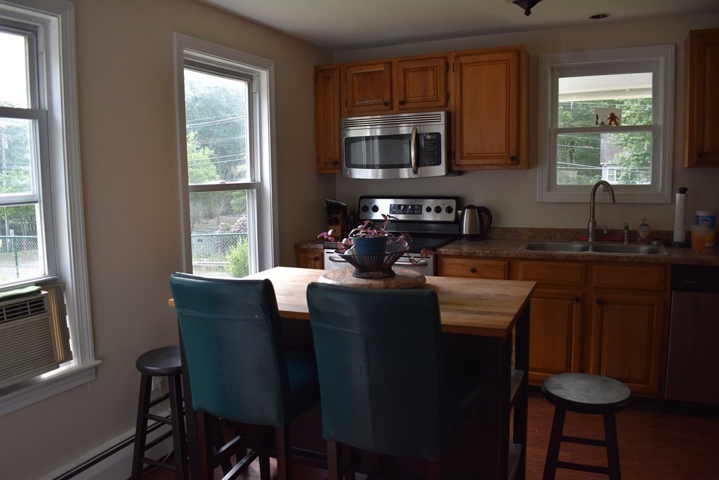 371 Worcester Road Charlton, MA 01507 - Photo 19 of 35 a kitchen with granite countertop a sink cabinets and appliances