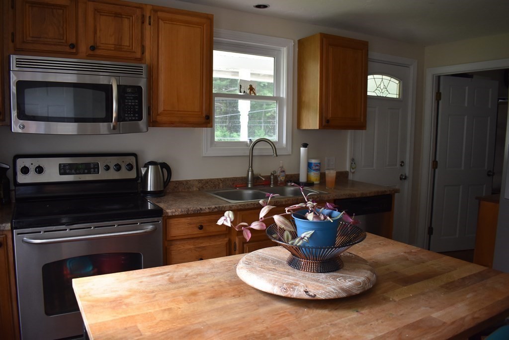 371 Worcester Road Charlton, MA 01507 - Photo 20 of 35 a kitchen with a stove and a microwave