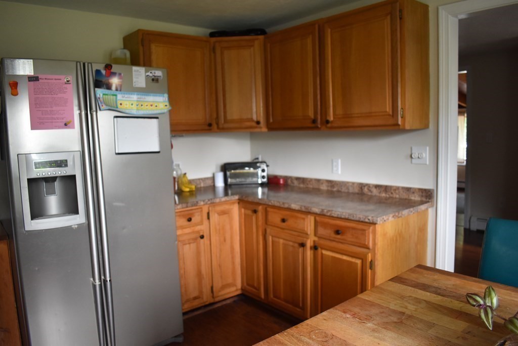 371 Worcester Road Charlton, MA 01507 - Photo 21 of 35 a kitchen with stainless steel appliances granite countertop a refrigerator and a stove top oven