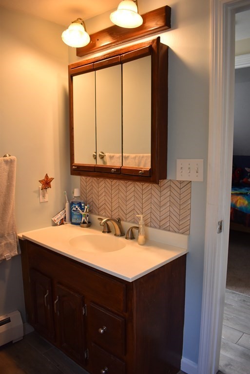 371 Worcester Road Charlton, MA 01507 - Photo 27 of 35 a bathroom with a sink vanity and a mirror