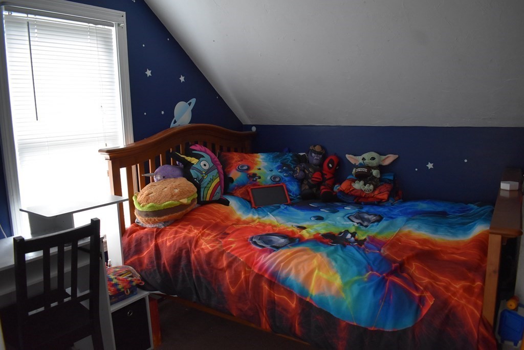 371 Worcester Road Charlton, MA 01507 - Photo 30 of 35 a bed room with a bed and a couch