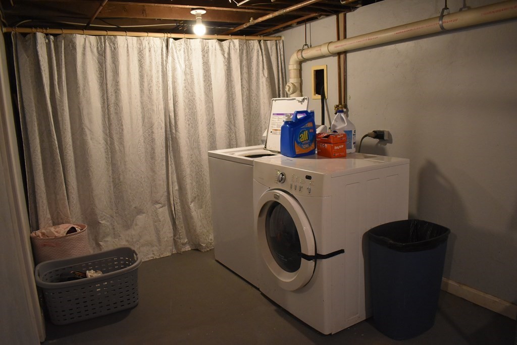 371 Worcester Road Charlton, MA 01507 - Photo 31 of 35 a view of a storage room with washer and dryer
