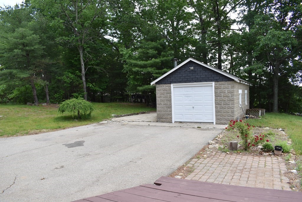 371 Worcester Road Charlton, MA 01507 - Photo 34 of 35 a front view of a house with a yard and garage