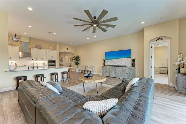 a large kitchen with stainless steel appliances lots of counter space and a sink
