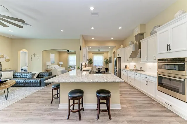 a view of a dining room with furniture and wooden floor
