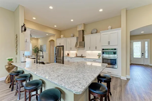 a dining room with a table and chairs