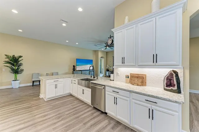 a bathroom with a granite countertop sink mirror and