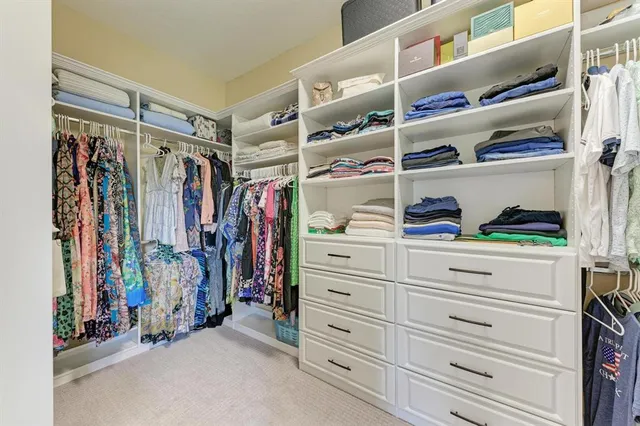 a view of a swimming pool with outdoor seating and plants