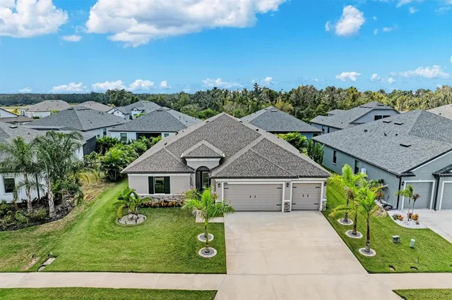 a view of a livingroom with wooden floor and a window
