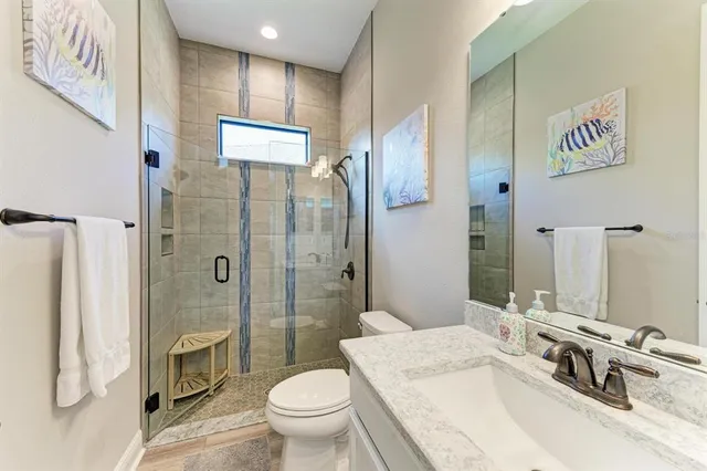 a view of a swimming pool with outdoor seating and a patio