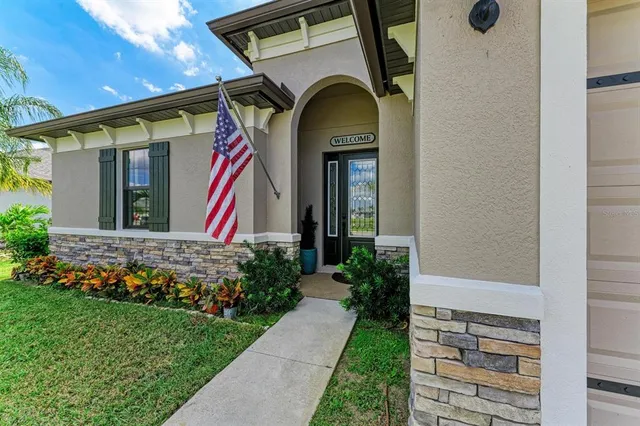 a living room with furniture and view of kitchen