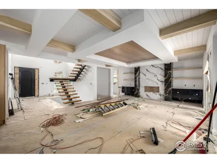 a view of a livingroom with furniture and a kitchen