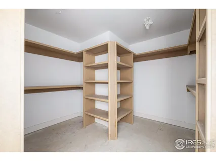 a view of closet area with empty racks
