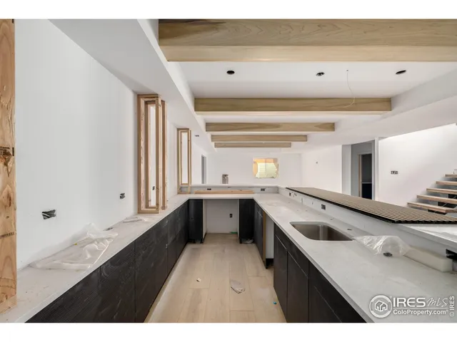 a kitchen with a sink stove and microwave