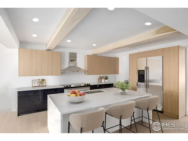 a kitchen with stainless steel appliances kitchen island granite countertop a sink and cabinets