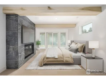 a living room with a bed furniture and a fireplace