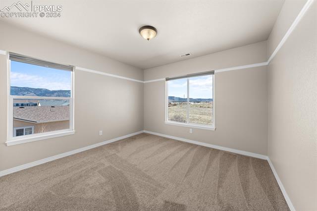 766 Struthers Ranch Road Colorado Springs, CO 80921 - Photo 16 of 40 The first bedroom with great views to the northwest