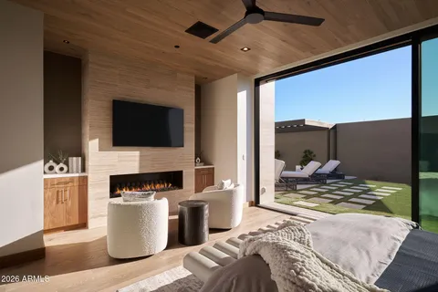 a bedroom with a bed and a fireplace