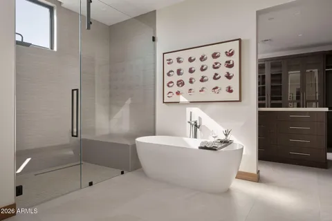 a bathroom with a bathtub and shower