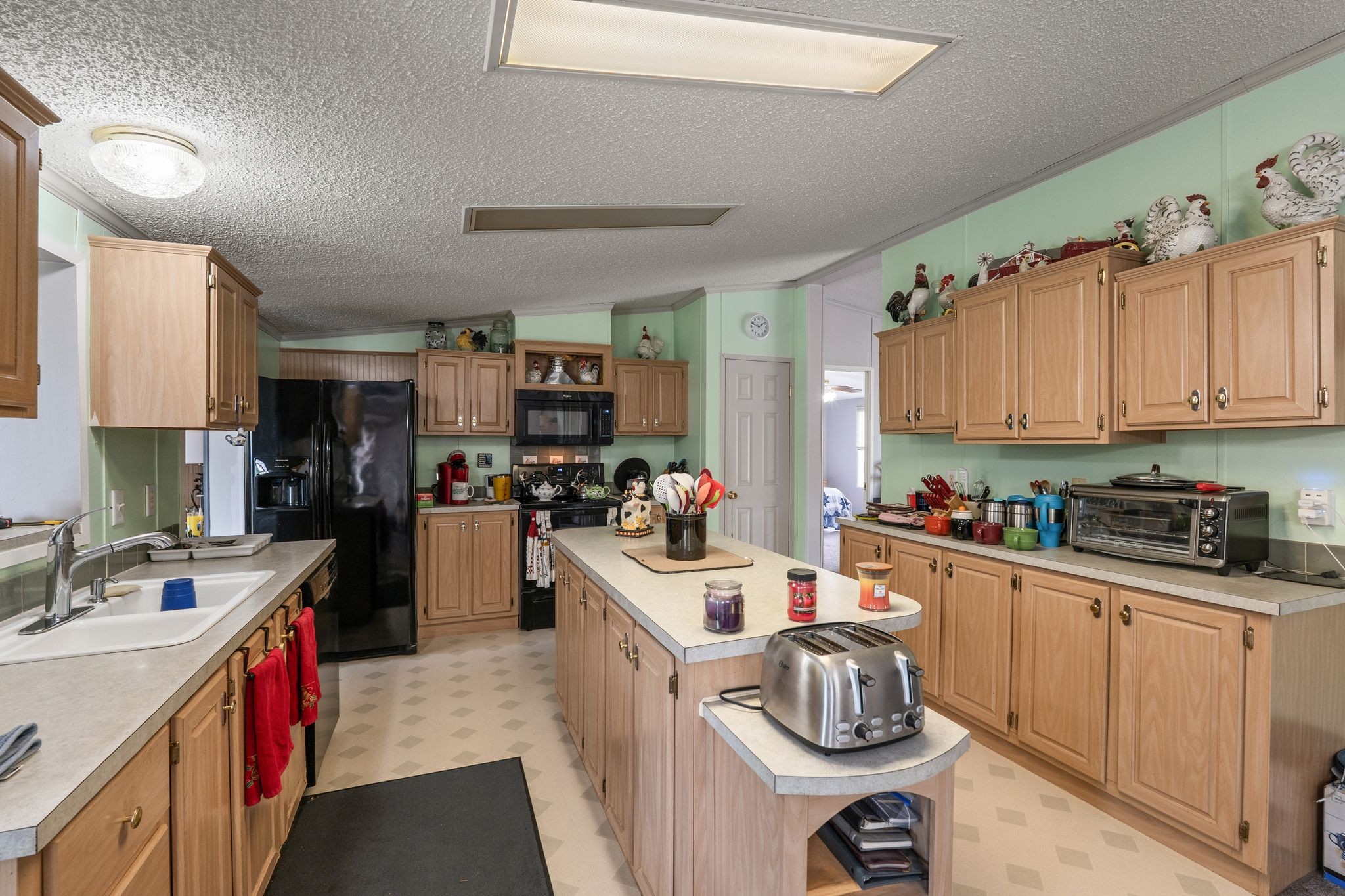 2636 Balthrop Road Pleasant View, TN 37146 - Photo 13 of 63 a kitchen with stainless steel appliances granite countertop a sink dishwasher stove refrigerator and cabinets