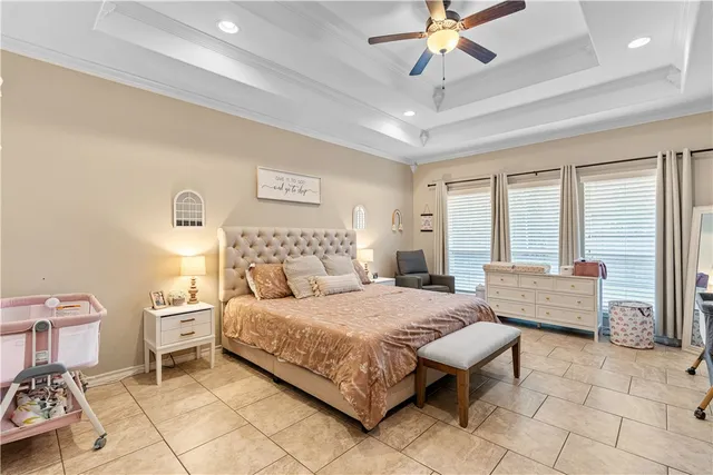 a bedroom with a bed and a couch