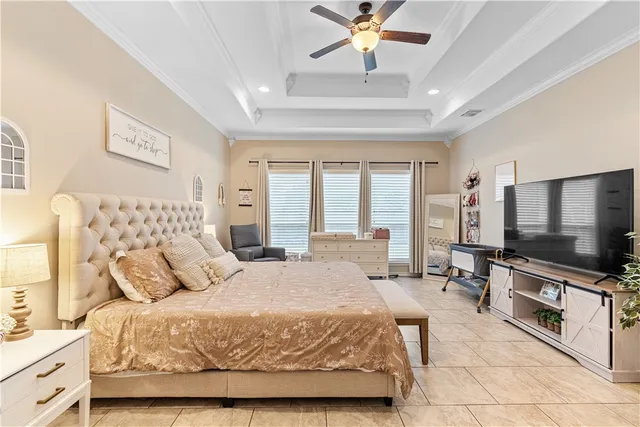 a bedroom with a bed and glass door