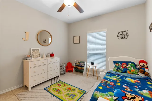 a bed room with a bed and a window