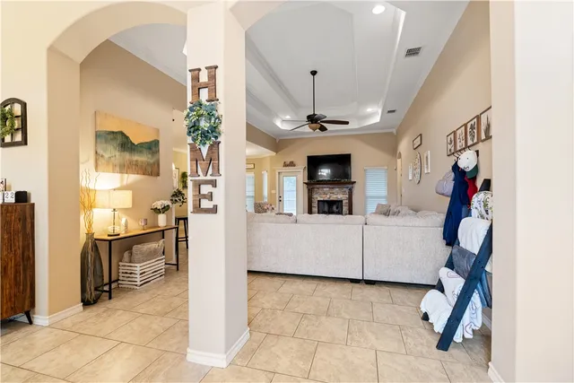 a view of living room kitchen and entryway