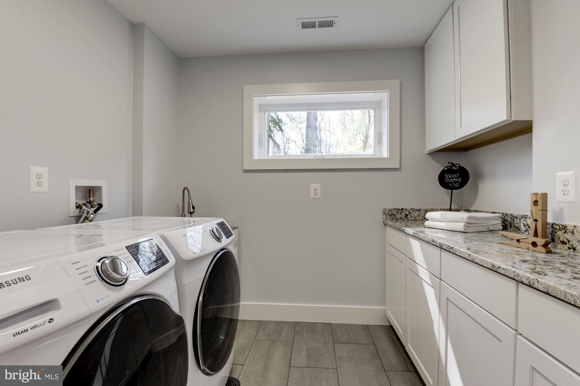 10526 Hunters Valley Road Vienna, VA 22181 - Photo 36 of 59 Separate Laundry Rm with Cabinets, Granite & Sink.