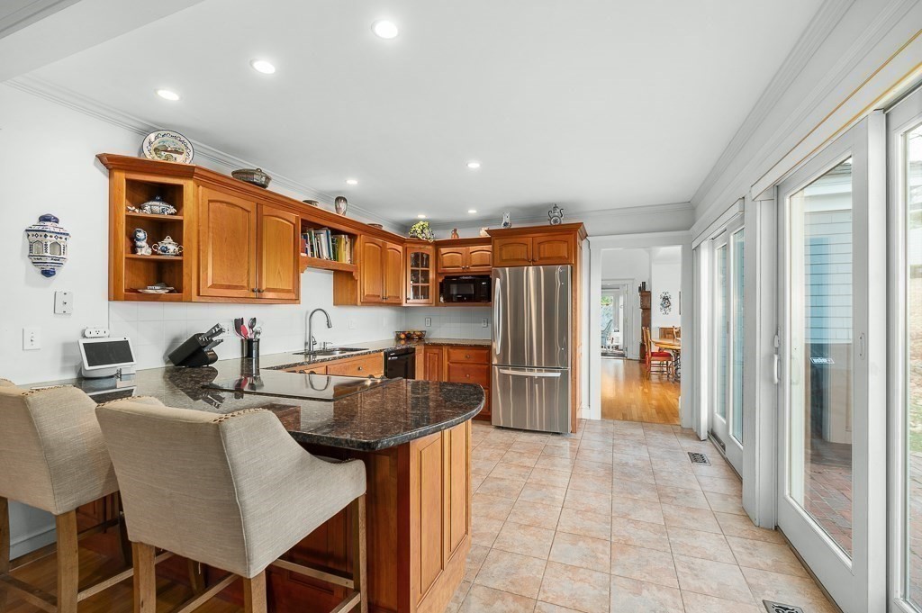 34 Decatur Street Gloucester, MA 01930 - Photo 20 of 31 a kitchen with stainless steel appliances granite countertop a refrigerator and a sink