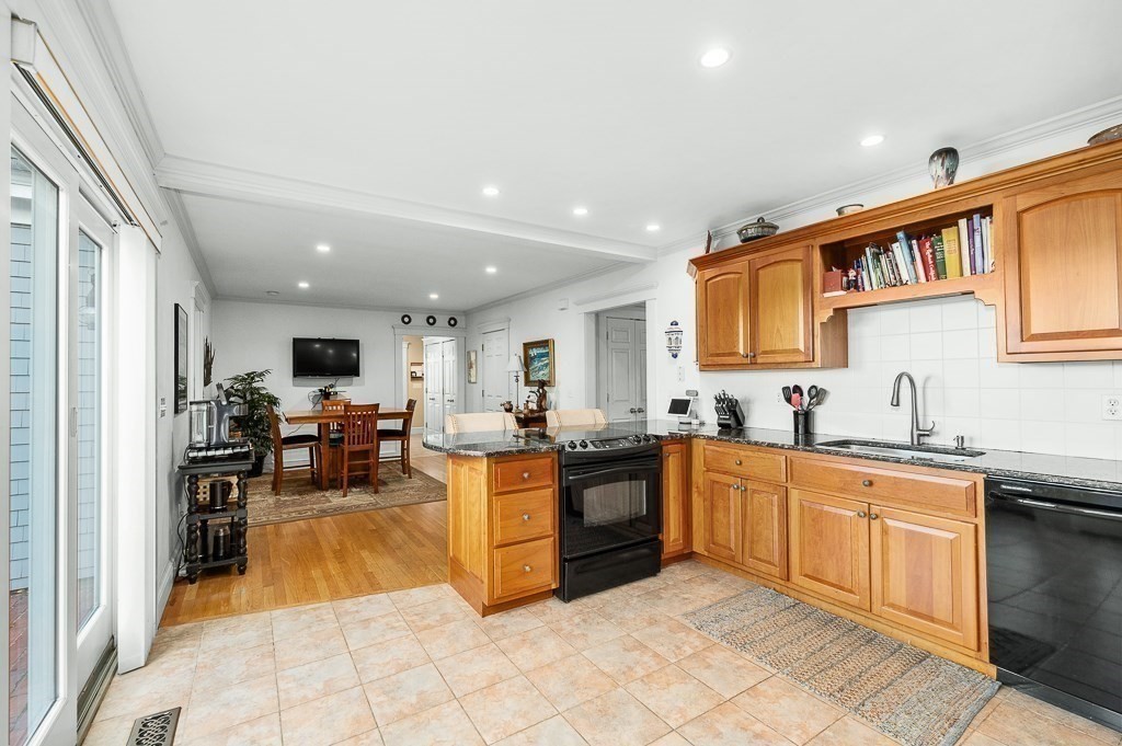 34 Decatur Street Gloucester, MA 01930 - Photo 21 of 31 a kitchen with stainless steel appliances granite countertop sink stove and cabinets
