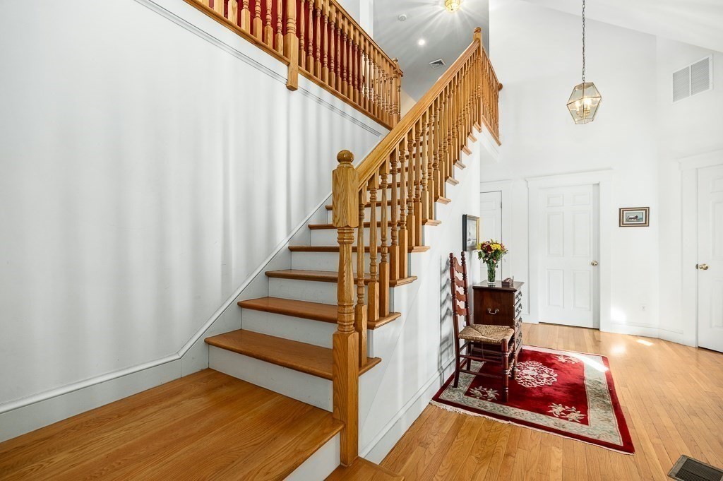 34 Decatur Street Gloucester, MA 01930 - Photo 22 of 31 a view of entryway with wooden floor and stairs
