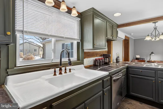 a kitchen with lots of counter space and a sink