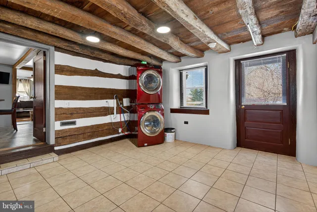 a view of an entryway with wooden floor