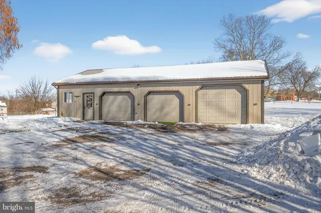a bedroom with furniture and a fireplace