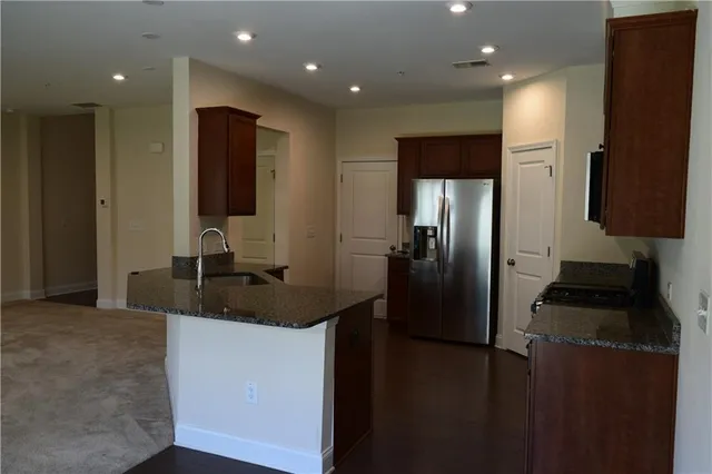 a view of an empty room with a fireplace