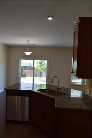 a living room with a fireplace and a window